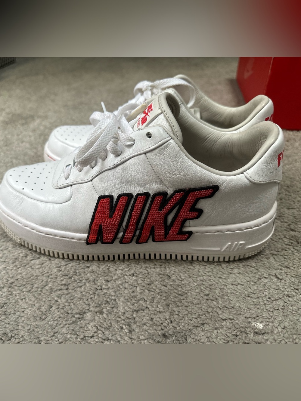 Nike “Force Is Female” White Sneakers with Red Sequin NIKE Patch